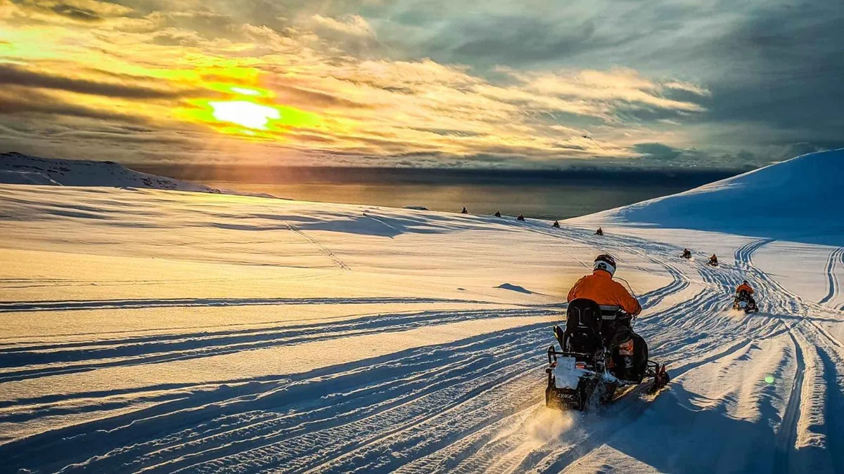 Snowmobiles on the Eyjafjallajokull ice cap on an Iceland volcano tour from the south coast