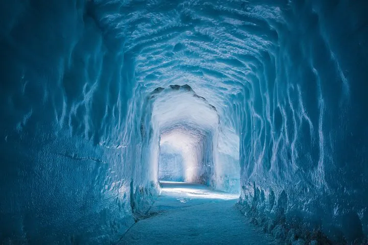 Lit ice tunnel inside the Langjokull glacier on an Into the Glacier day tour from Reykjavik