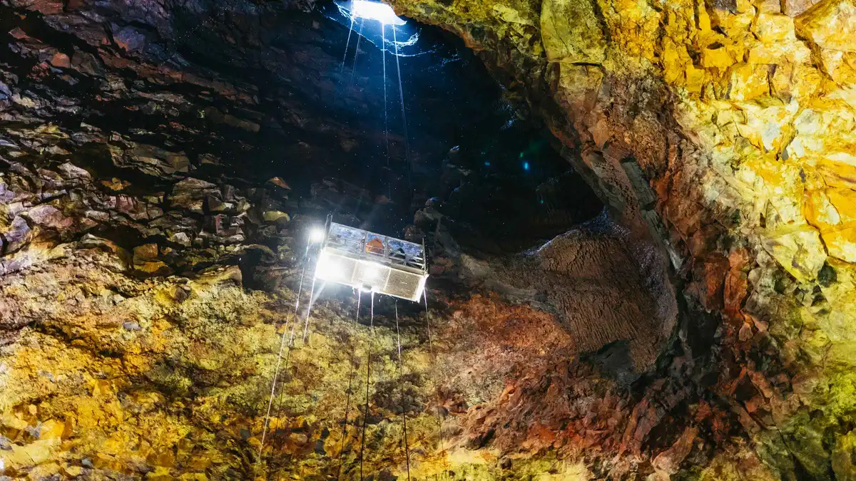 Open lift descending into the Thrihnukagigur magma chamber on an inside the volcano Iceland tour